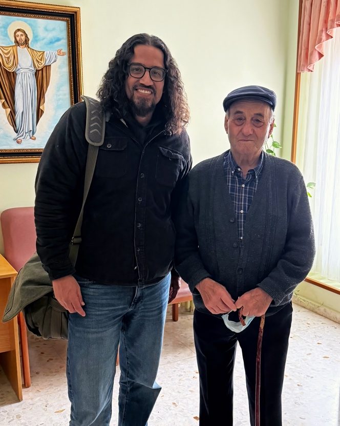 The author standing with a 93-year-old man from Cisneros who became his Y-DNA match